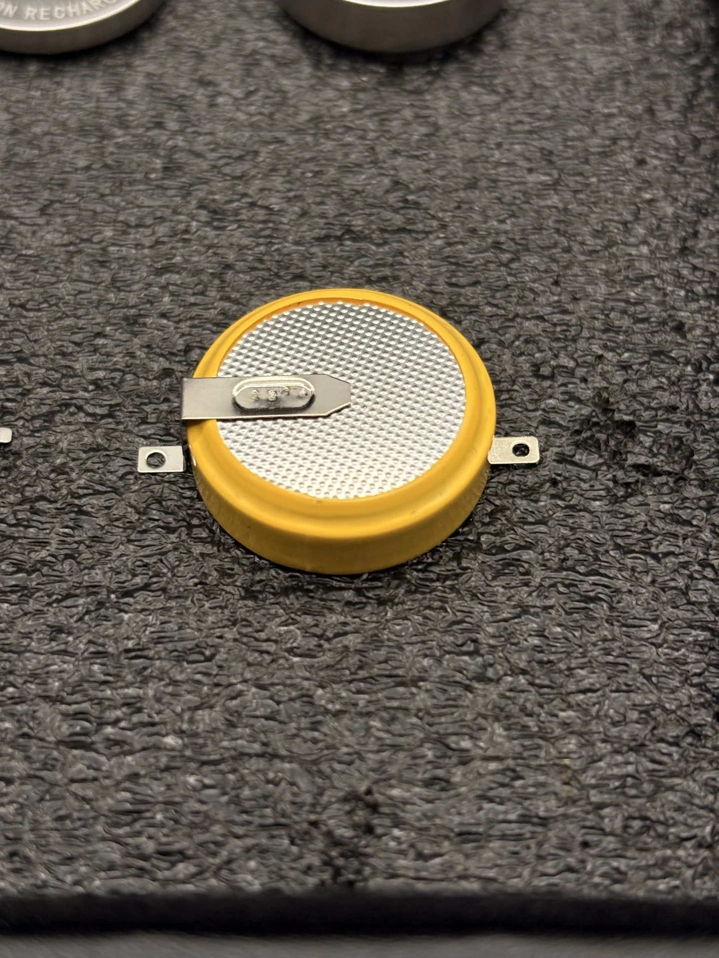 Pin-type rechargeable coin cell, macro close-up